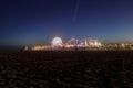 Santa Monica Pier boardwalk lit up at night